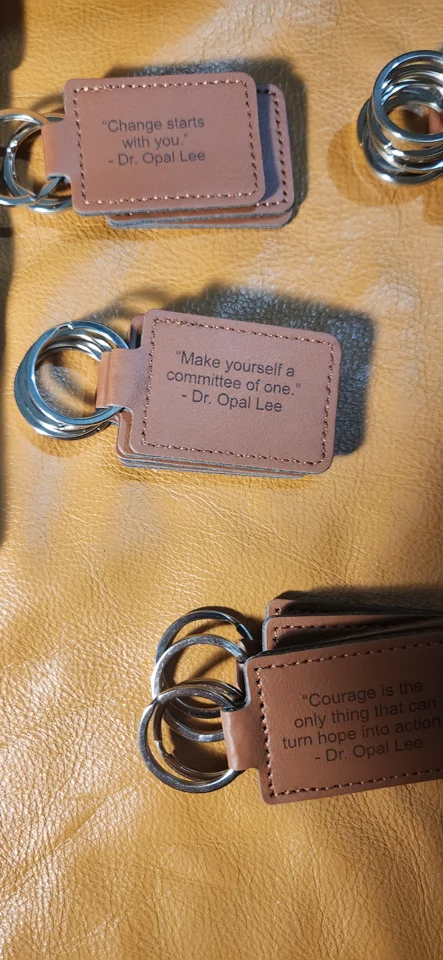 Dr. Lee's words were engraved onto leather keychains to be given as reading prizes. Hopefully some will find their way onto backpacks and into pockets—and perhaps inspire someone to ask, “Who is Dr. Opal Lee?”