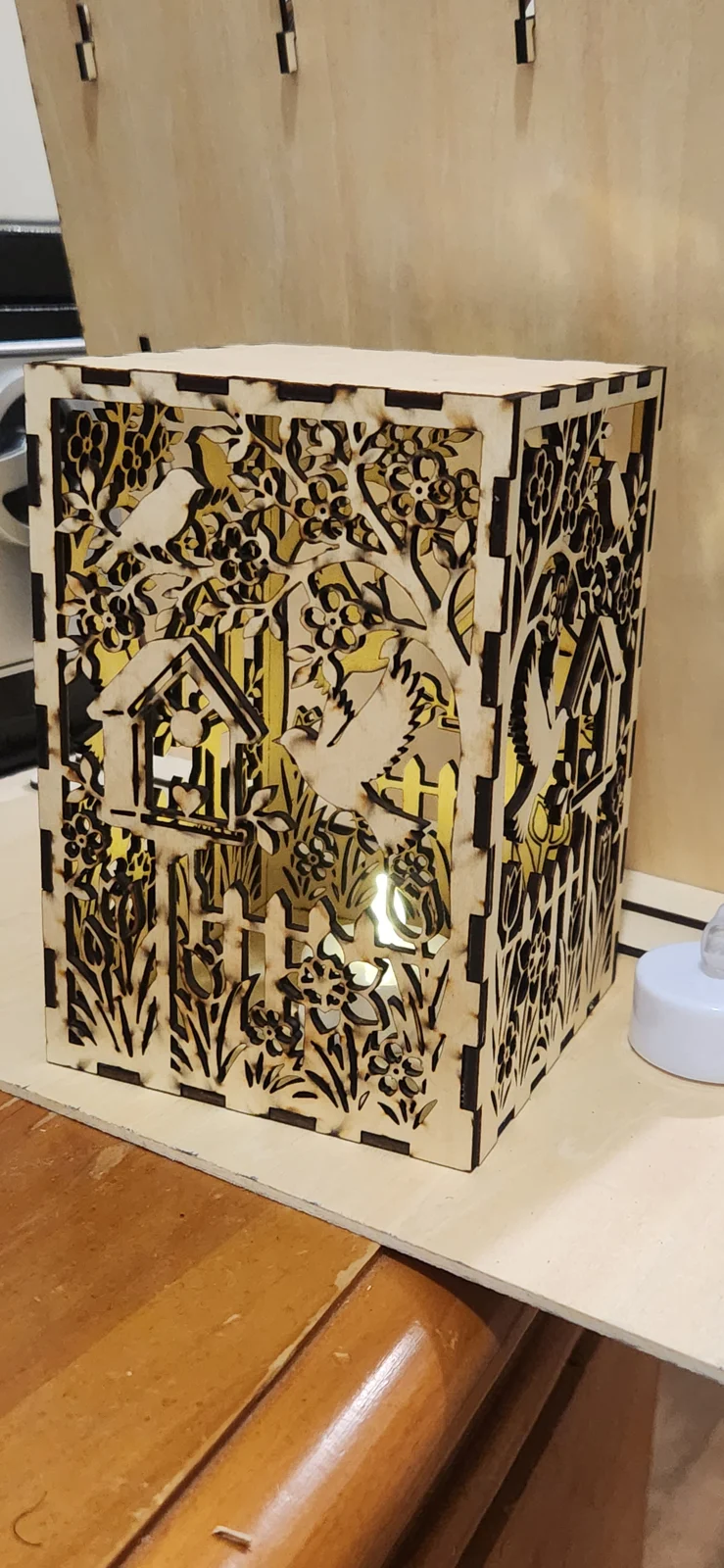 Birds, blossoms, and a warm glow for the evening. cut lamp